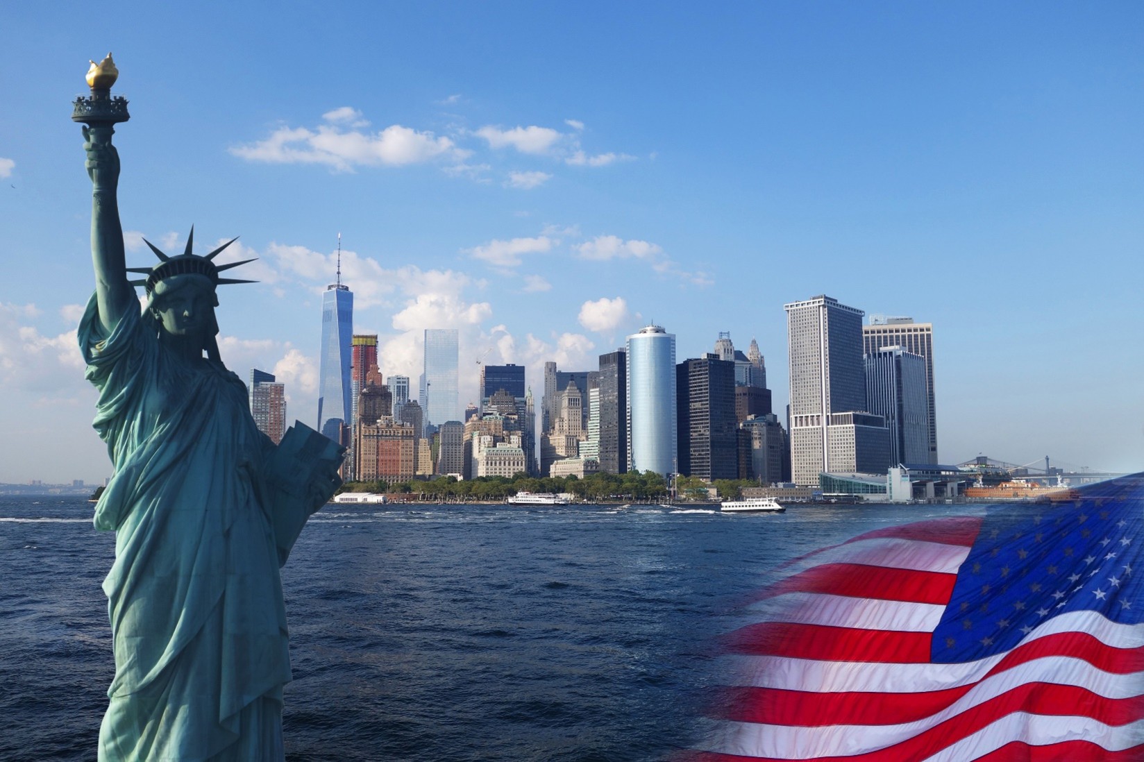 A view of New York City surrounded by water with the Statue of Liberty and an American flag in the foreground.