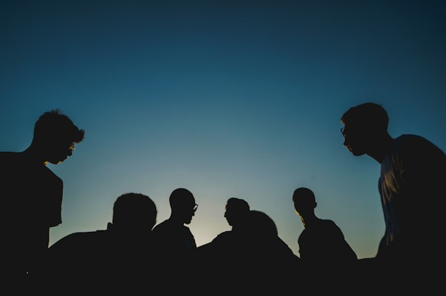 a silhouette of a group of people 